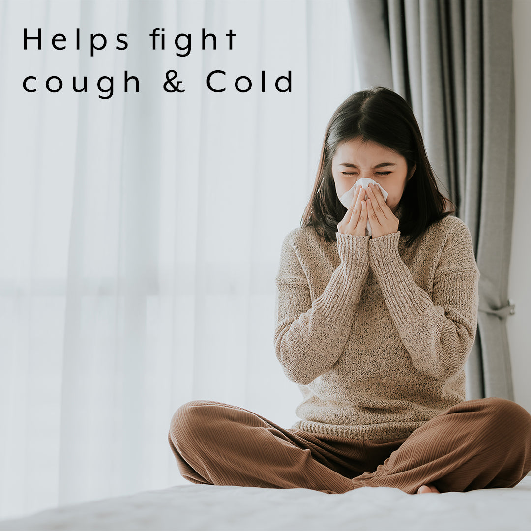 benefits of immune support showing woman coughing to show it helps fight cough and cold